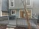 A wooden deck with railings and steps, perfect for outdoor entertaining and relaxation at 1063 Riverbend Club Se Dr, Atlanta, GA 30339