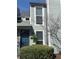 Two story home featuring a dark blue front door and light grey siding at 1063 Riverbend Club Se Dr, Atlanta, GA 30339