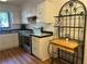 Cozy kitchen featuring stainless steel appliances and white cabinets at 1063 Riverbend Club Se Dr, Atlanta, GA 30339
