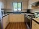 Efficient kitchen featuring white cabinets and stainless steel appliances at 1063 Riverbend Club Se Dr, Atlanta, GA 30339