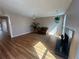 Bright and airy living room with light hardwood floors, fireplace, and neutral walls at 1063 Riverbend Club Se Dr, Atlanta, GA 30339