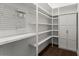 Custom closet with shelving and pegboard system to keep you organized and tidy at 13 Ganel Ln, Alpharetta, GA 30009