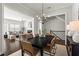 Inviting dining room with hardwood floors, stylish chandelier, and views into the living room at 13 Ganel Ln, Alpharetta, GA 30009