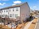 Exterior view of townhome featuring a deck and lush greenery in front at 13 Ganel Ln, Alpharetta, GA 30009