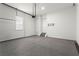 Spacious garage with an epoxy floor and ample room for parking and storage at 13 Ganel Ln, Alpharetta, GA 30009