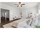 Spacious primary bedroom featuring a tray ceiling, soft carpet, and large windows at 13 Ganel Ln, Alpharetta, GA 30009