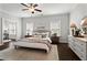 Serene primary bedroom with neutral tones, a ceiling fan, and natural light at 13 Ganel Ln, Alpharetta, GA 30009