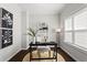 Stylishly designed office space with dark hardwood floors, a black desk, and a neutral-toned chair at 13 Ganel Ln, Alpharetta, GA 30009
