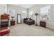 Cozy bedroom with neutral carpeting, three windows, and an eclectic mix of furniture at 1315 Golden Rock Se Ln # 2, Marietta, GA 30067