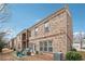 Multi-story brick condo building with a small patio area and well-maintained landscaping at 1315 Golden Rock Se Ln # 2, Marietta, GA 30067