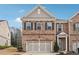 Charming two-story brick home featuring a two-car garage and a welcoming front porch at 1315 Golden Rock Se Ln # 2, Marietta, GA 30067