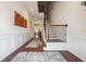 Bright foyer with hardwood floors, decorative molding, and staircase with iron railing at 1315 Golden Rock Se Ln # 2, Marietta, GA 30067