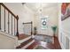 Inviting foyer with hardwood floors, stylish chandelier, and elegant wainscoting at 1315 Golden Rock Se Ln # 2, Marietta, GA 30067