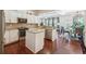 Open-concept kitchen with an island, stainless steel appliances, and hardwood flooring at 1315 Golden Rock Se Ln # 2, Marietta, GA 30067