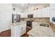 Modern kitchen featuring granite countertops, stainless steel appliances, and ample cabinet space at 1315 Golden Rock Se Ln # 2, Marietta, GA 30067