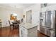 Kitchen with a large island, stainless steel fridge and nearby dining area at 1315 Golden Rock Se Ln # 2, Marietta, GA 30067