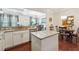 Open-concept kitchen with granite countertops and a breakfast bar overlooking the dining area at 1315 Golden Rock Se Ln # 2, Marietta, GA 30067