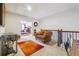 Spacious loft featuring an arm chair, an eye-catching rug, and a glimpse into the main bedroom at 1315 Golden Rock Se Ln # 2, Marietta, GA 30067