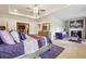Comfortable main bedroom featuring a tray ceiling, fireplace, and purple accents at 1315 Golden Rock Se Ln # 2, Marietta, GA 30067