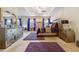 A beautifully decorated main bedroom featuring a tray ceiling, large mirror, dresser and purple accents at 1315 Golden Rock Se Ln # 2, Marietta, GA 30067