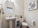 Cozy powder room featuring a pedestal sink and toilet at 1315 Golden Rock Se Ln # 2, Marietta, GA 30067