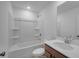 Modern bathroom with a bathtub and shower combination plus vanity and mirror at 1745 Lansmere Sw St, Marietta, GA 30008