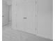 A bedroom featuring a closet with white bi-fold doors and plush gray carpeting throughout at 1745 Lansmere Sw St, Marietta, GA 30008