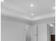 Bright bedroom with recessed lighting, white walls, and an open door to an en-suite bathroom at 1745 Lansmere Sw St, Marietta, GA 30008