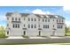 Stylish townhome exteriors feature white brick, black trim, and individual garages, complete with well-manicured lawns at 1745 Lansmere Sw St, Marietta, GA 30008