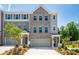 Charming townhome with a two-car garage, attractive brickwork, and a well-maintained front yard at 1745 Lansmere Sw St, Marietta, GA 30008