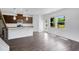 Bright kitchen with stainless steel appliances, granite countertops, an island, and hardwood floors at 1745 Lansmere Sw St, Marietta, GA 30008