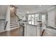 Open-concept kitchen with an island, pendant lighting, and direct view of the dining area and stairs at 1745 Lansmere Sw St, Marietta, GA 30008