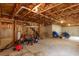 Unfinished basement with exposed ceiling, concrete foundation, and ample storage space at 203 Overlook Ct, Dallas, GA 30157