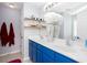 Bright bathroom featuring double sinks with stylish vanity and decorative shelving for storage and decor at 203 Overlook Ct, Dallas, GA 30157