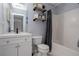 Clean bathroom features a white vanity, a toilet, and a bathtub with a shower curtain at 203 Overlook Ct, Dallas, GA 30157