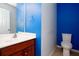 Bright half-bathroom with new lighting and a modern vanity at 203 Overlook Ct, Dallas, GA 30157