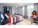 Cozy bedroom with a ceiling fan, a large closet, and a comfortable bed at 203 Overlook Ct, Dallas, GA 30157