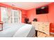 Bright bedroom featuring a comfortable bed, dresser, and a large window with natural light at 203 Overlook Ct, Dallas, GA 30157
