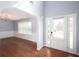 Open entryway featuring pristine hardwood floors and neutral wall paint at 203 Overlook Ct, Dallas, GA 30157