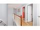 Bright hallway with wood floors and a staircase, connecting different parts of the house at 203 Overlook Ct, Dallas, GA 30157