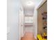Hallway area with hardwood floors and access to a pantry at 203 Overlook Ct, Dallas, GA 30157