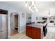 Open kitchen featuring stainless steel appliances and a view into the dining and living areas at 203 Overlook Ct, Dallas, GA 30157