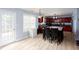 Kitchen with stainless steel appliances, an eat-in island, and access to the backyard at 203 Overlook Ct, Dallas, GA 30157