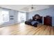 Spacious main bedroom boasts tray ceilings, wood floors, and large windows for lots of natural light at 203 Overlook Ct, Dallas, GA 30157