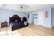 This spacious main bedroom offers plenty of natural light and features wood floors and neutral blue walls at 203 Overlook Ct, Dallas, GA 30157