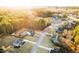Aerial view of a lovely home nestled in a wooded neighborhood, featuring mature trees and landscaping at 35 Rock Rose Dr, Covington, GA 30014