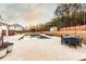 Relaxing backyard with a pristine pool, lounge chairs, and an outdoor dining set at 35 Rock Rose Dr, Covington, GA 30014
