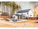 Wide-angle view of a well-maintained backyard with pool, patio, and privacy fence against a backdrop of trees at 35 Rock Rose Dr, Covington, GA 30014