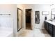Bathroom featuring shower, walk-in closet, and dual sink vanity at 35 Rock Rose Dr, Covington, GA 30014