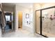 Bathroom featuring a glass-enclosed shower and soaking tub at 35 Rock Rose Dr, Covington, GA 30014